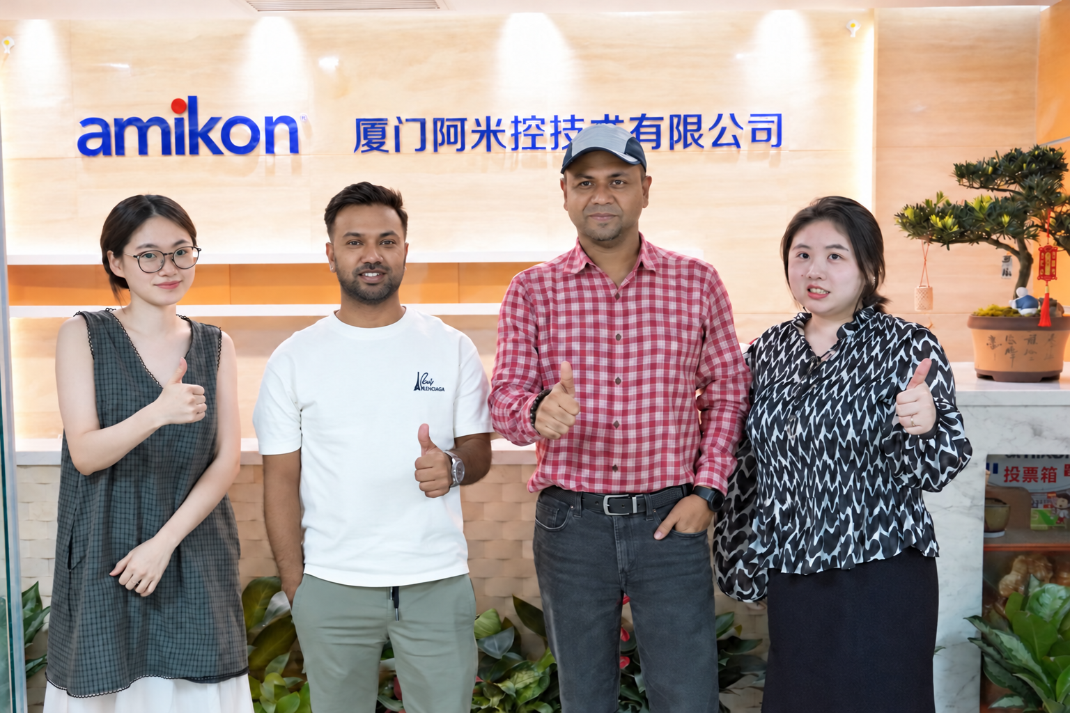 Bangladeshi customers and the Amikon team at the Amikon office